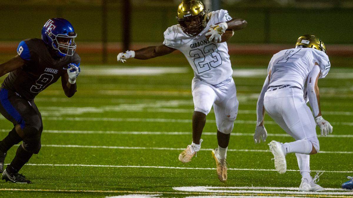 Cardinal Gibbons’s Donovan Shepard (23) looks for running room against Wake Forest during the second half Friday, Sept. 10, 2021 at Cardinal Gibbons High School in Raleigh. Cardinal Gibbons won 33-9.