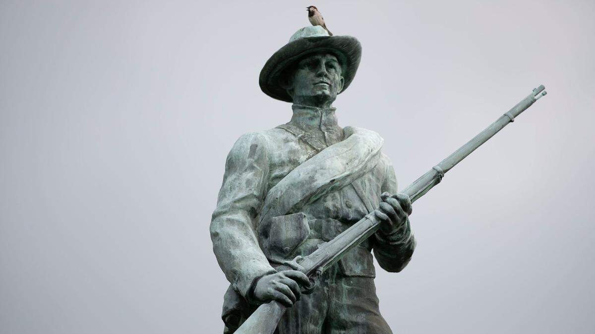 A House Sparrow, sings atop the Confederate monument on N. Main Street in Louisburg, N.C. on Thursday, June 24, 2020. The Louisburg town council voted on Monday to have the monument moved to a nearby cemetery where Confederate veterans are buried.