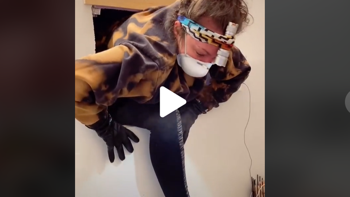 A woman found a hidden apartment behind her bathroom mirror, documenting the strange discovery on TikTok.