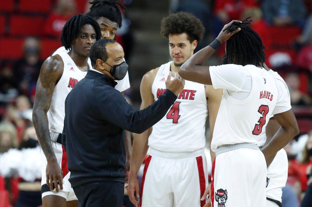 N.C. State head coach Kevin Keatts talks with his team during the first half of N.C. State’s game against Louisiana Tech at PNC Arena in Raleigh, N.C., Saturday, November 27, 2021.