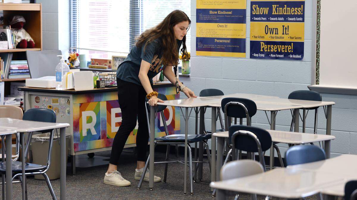 Dillard Drive Magnet Middle School 8th grade ELA teacher Anna Diesing works on setting up her classroom Thursday, August 21, 2025.