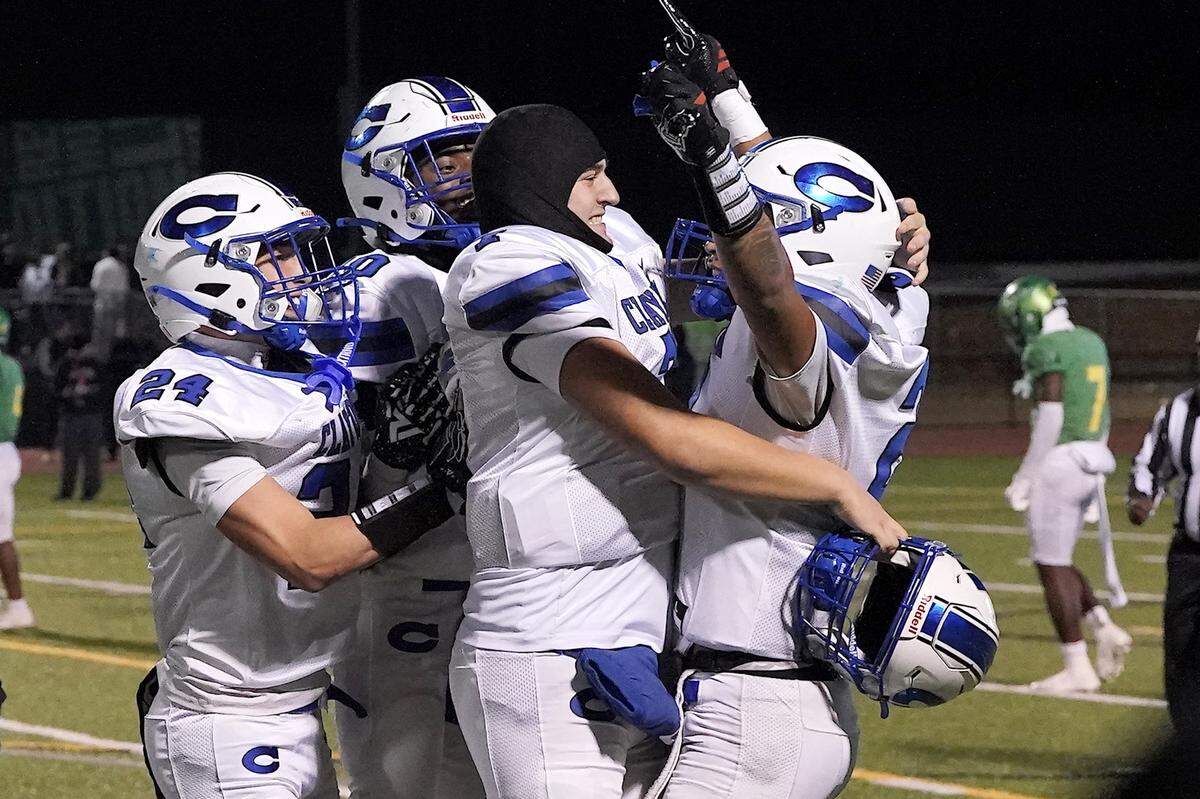 Clayton players celebrate their impending victory over Cardinal Gibbons late in the second half of the 7A East Regional Final. The Clayton Comets and the Cardinal Gibbons Crusaders met in the East Regional Final of the NCHSAA 7A Football Championship in Clayton, N.C. on December 4, 2025.