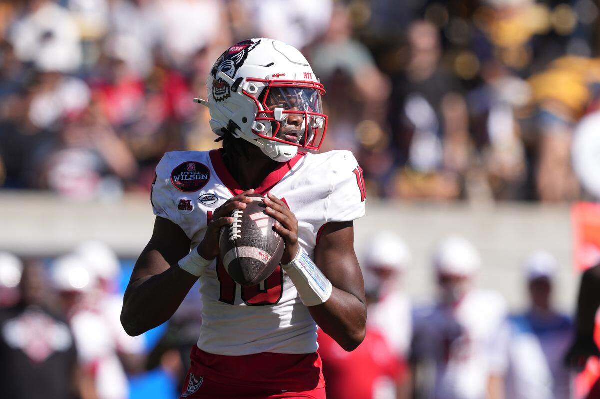 Oct 19, 2024; Berkeley, California, USA; North Carolina State Wolfpack quarterback CJ Bailey (16) drops back to pass against the California Golden Bears during the second quarter at California Memorial Stadium. Mandatory Credit: Darren Yamashita-Imagn Images