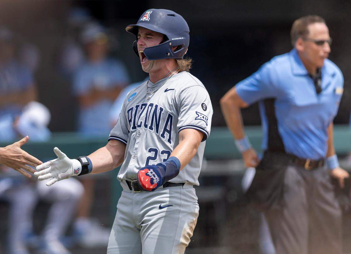 Arizona outfielder T.J. Adams (23) reacts after scoring the game winning run on a 2 RBI single by teammate Mason White in the eight inning to put the Wildcats ahead 4-3 over North Carolina in the NCAA Super Regional final on Sunday, June 8, 2025 at Boshamer Stadium in Chapel Hill, N.C.