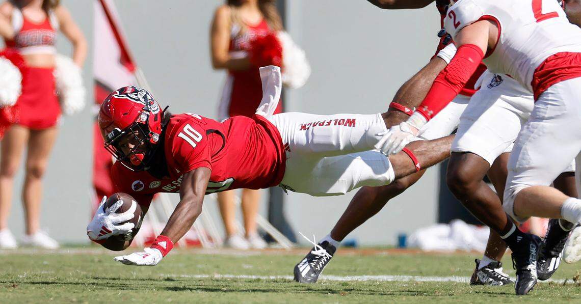 N.C. State wide receiver Kevin ‘KC’ Concepcion (10) dives for extra yards after making a reception during the second half of the Wolfpack’s 45-7 victory over VMI at Carter-Finley Stadium in Raleigh, N.C., Saturday, Sept. 16, 2023.