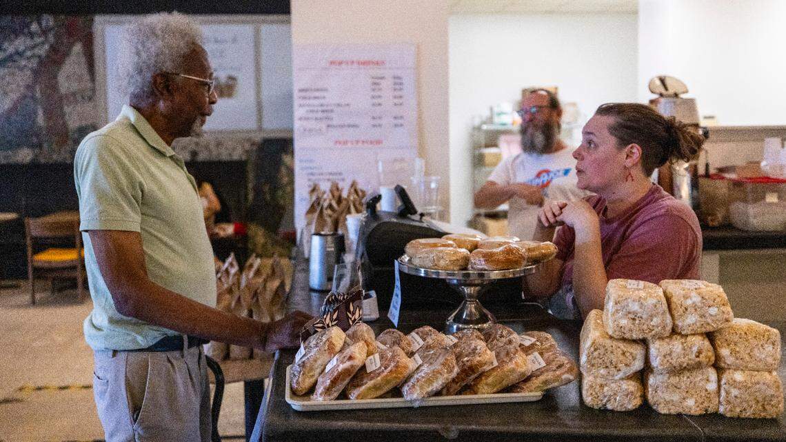 Co-owner Andi Macko takes an order from longtime customer Dr. Alvin Headen during the reopening of Cup-A-Joe’s Mission Valley location in Raleigh on Tuesday, June 24, 2025. The café closed in 2021 during the pandemic. Its soft-opening pop-up runs through Friday, June 27, from 8 a.m. to 1 p.m. The shop will close Friday afternoon and reopen Aug. 11.
