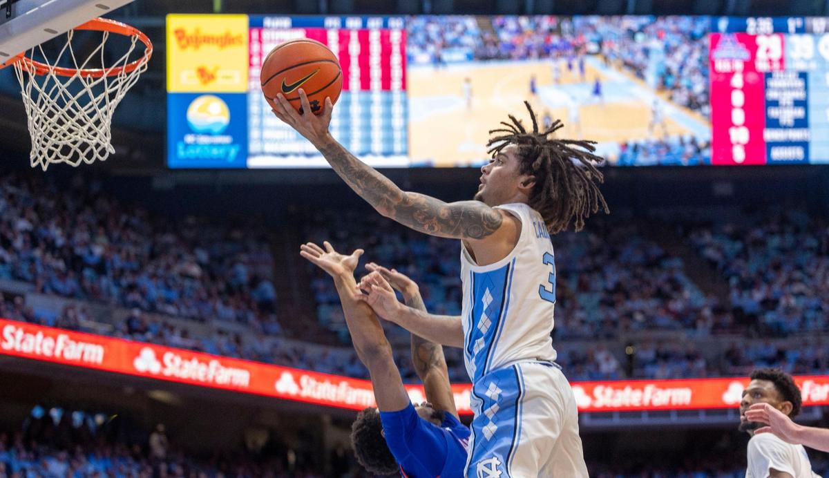 North Carolina guard Elliot Cadeau (3) drives to the basket against American University’s Colin Smalls (3) during the first half on Friday, November 15, 2024 at the Smith Center in Chapel Hill, N.C. Cadeau scored 15 points in the first half.