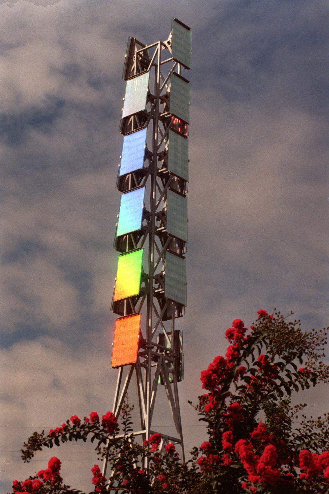 The Light + Time Tower reflects a rainbow of colors as the morning sun hits the artwork.