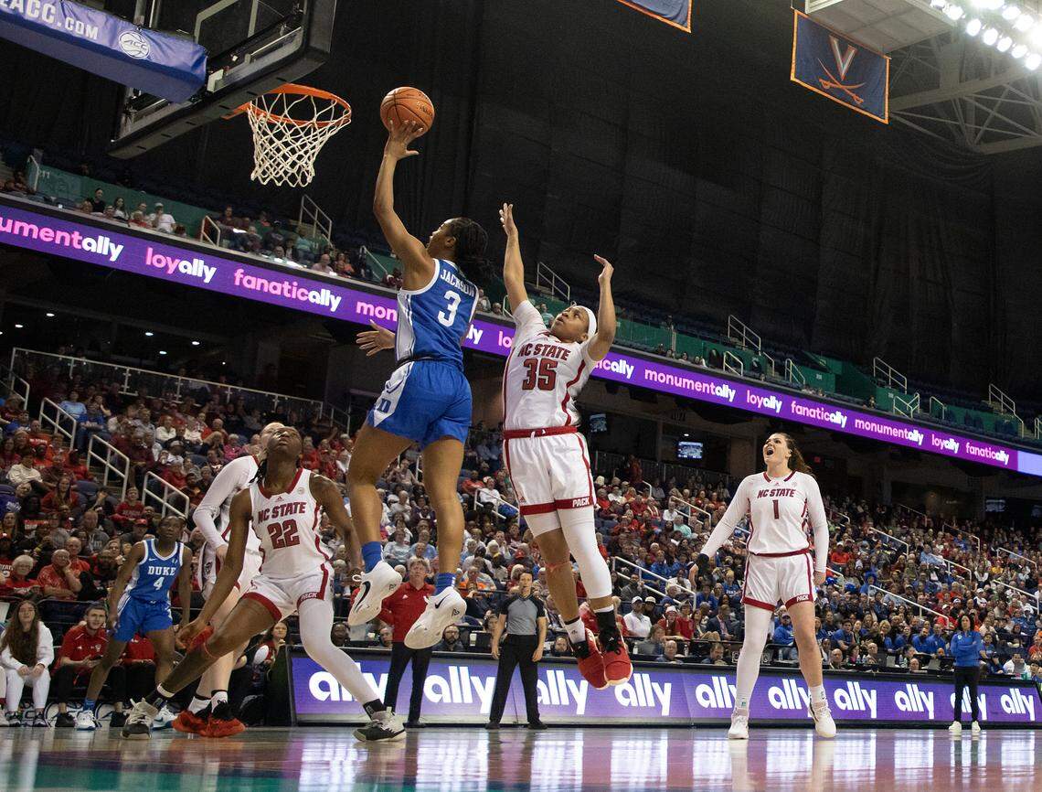 Duke’s Ashlon Jackson drives to the basket past N.C. State’s Zoe Brooks during the first half of an ACC Tournament quarterfinal game on Friday, March 8, 2024, at Greensboro Coliseum in Greensboro, N.C.