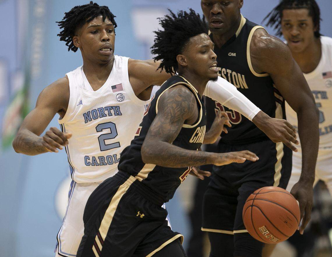 North Carolina’s Caleb Love (2) forces a turnover by College of Charleston’s Zep Jasper (12) defense during the first half on Wednesday, November 25, 2020 at the Smith Center in Chapel Hill, N.C.