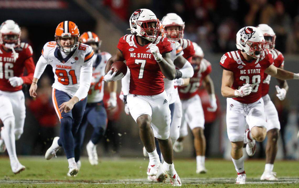 N.C. State’s Zonovan ‘Bam’ Knight (7) returns a kickoff 97-yards for a touchdown during the first half of N.C. State’s game against Syracuse at Carter-Finley Stadium in Raleigh, N.C., Saturday, Nov. 20, 2021.