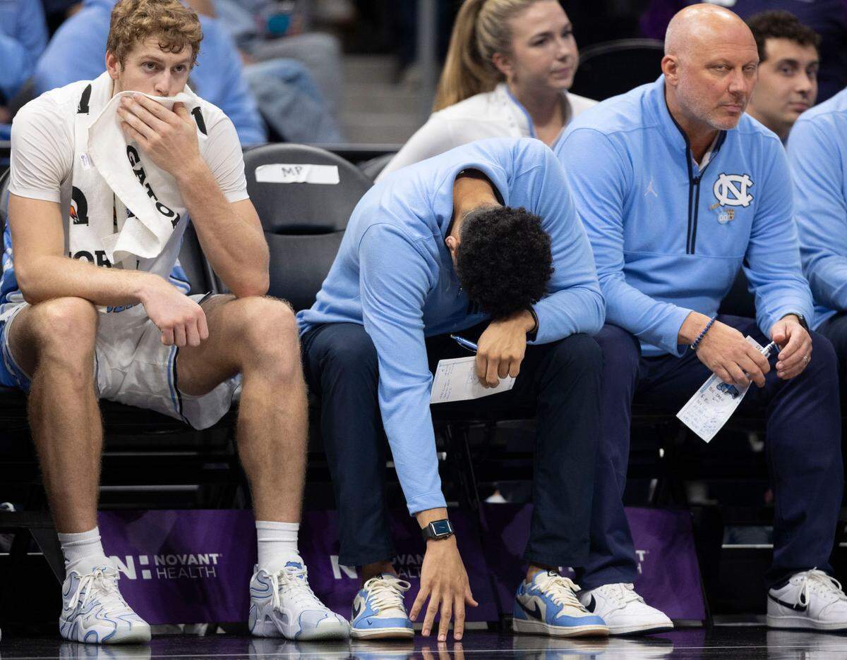 North Carolina assistant coach Marcus Paige hangs his head after guard Elliot Cadeau (3) missed a free throw with six seconds to play, securing Florida’s 90-84 victory, during the Jumpman Invitational on Tuesday, December 17, 2024 at the Spectrum Center in Charlotte, N.C.