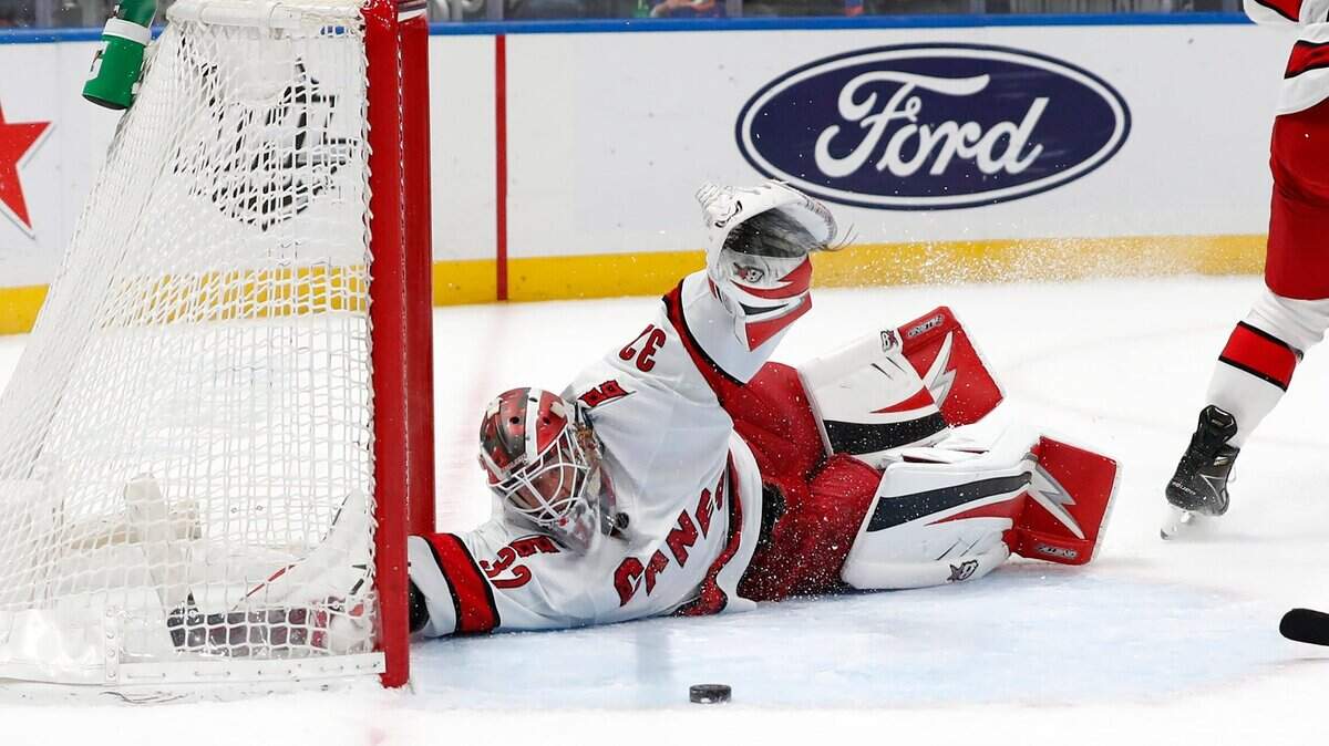 Carolina Hurricanes goaltender Antti Raanta (32) makes a save against the New York Islanders during the second period of an NHL hockey game, Sunday, Apr. 24, 2022, in New York. (AP Photo/Noah K. Murray)