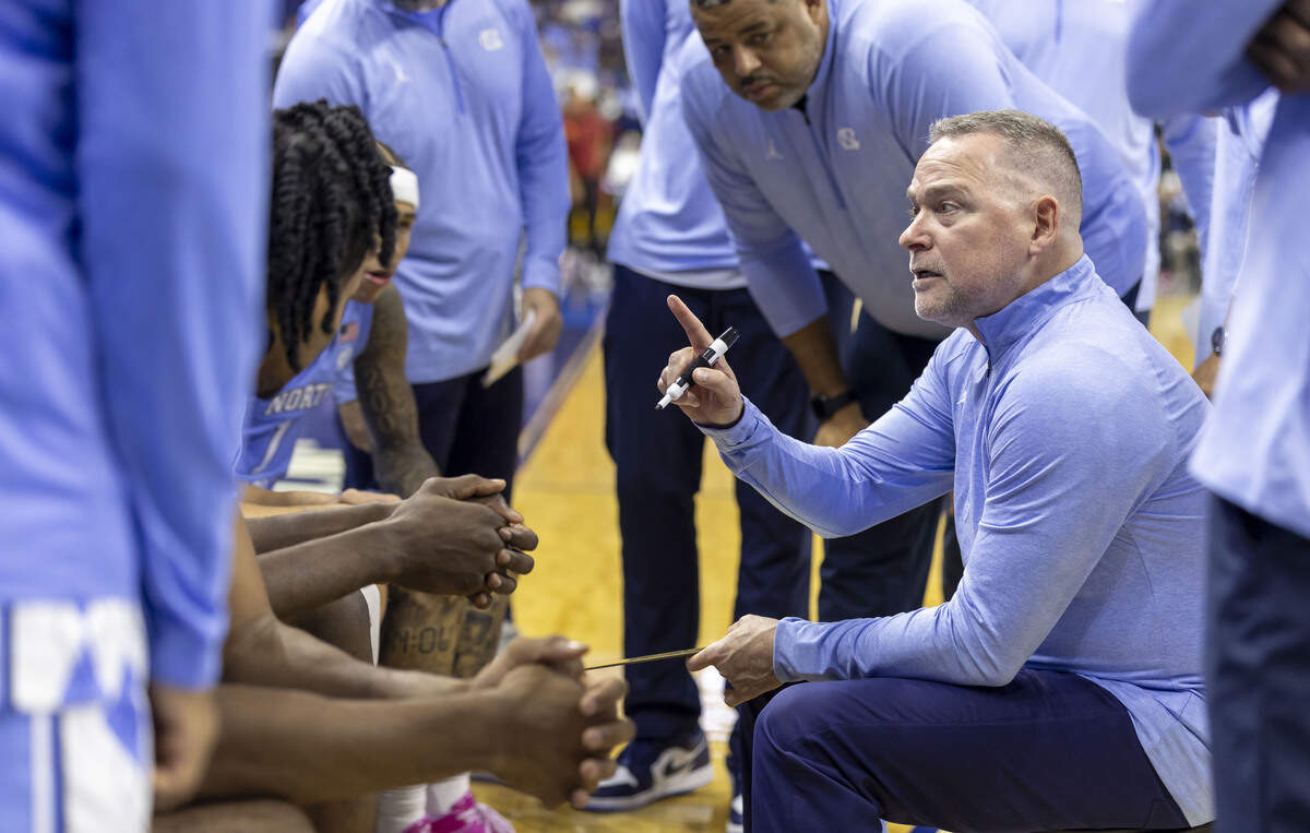 North Carolina coach Michael Malone huddles with his team in the first half against Southern California on Friday, Oct. 9, 2026, at the First Horizon Coliseum in Greensboro, N.C.