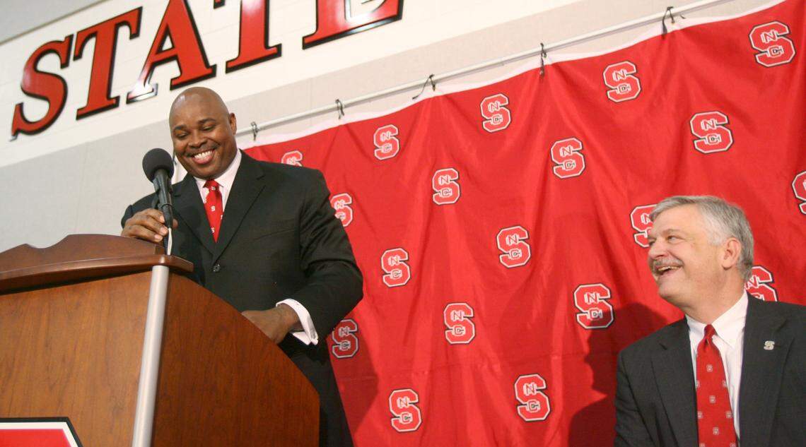 Sidney Lowe and Director of Athletics Lee Fowler are all smiles during a press conference in May 2006 announcing Lowe as the Wolfpack’s 18th men’s basketball coach.