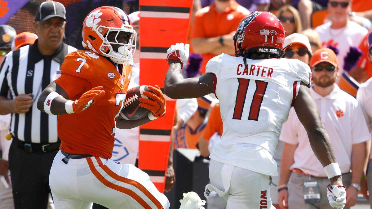 N.C. State safety Ja’Had Carter (11) closes in on Clemson running back Phil Mafah (7) during the first half of their game at Memorial Stadium in Clemson, S.C., Saturday, Sept. 21, 2024.