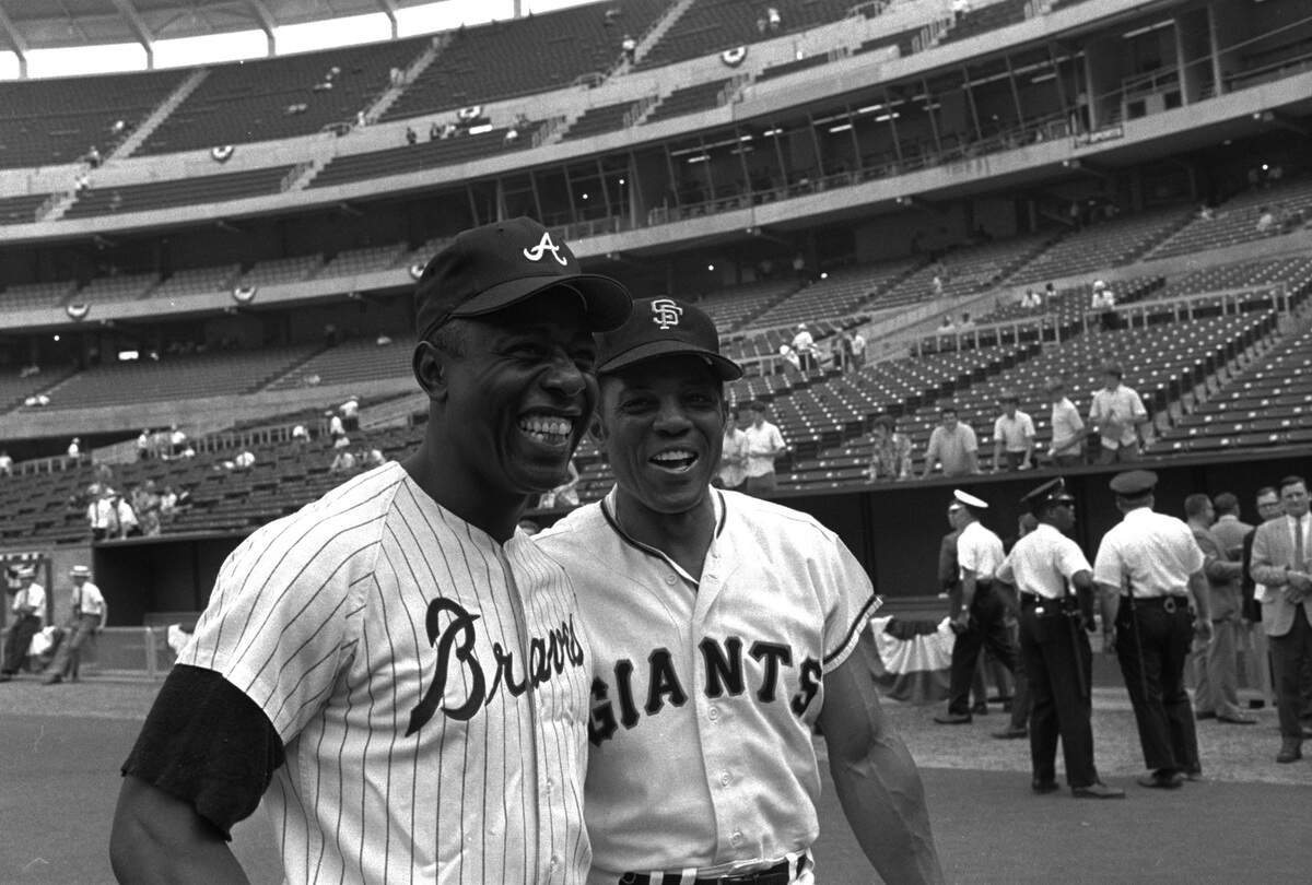 Hank Aaron, left, of the Atlanta Braves, and Willie Mays of the San Francisco Giants, get together for a chat prior the All-Star game in Cincinnati on July 14, 1970.