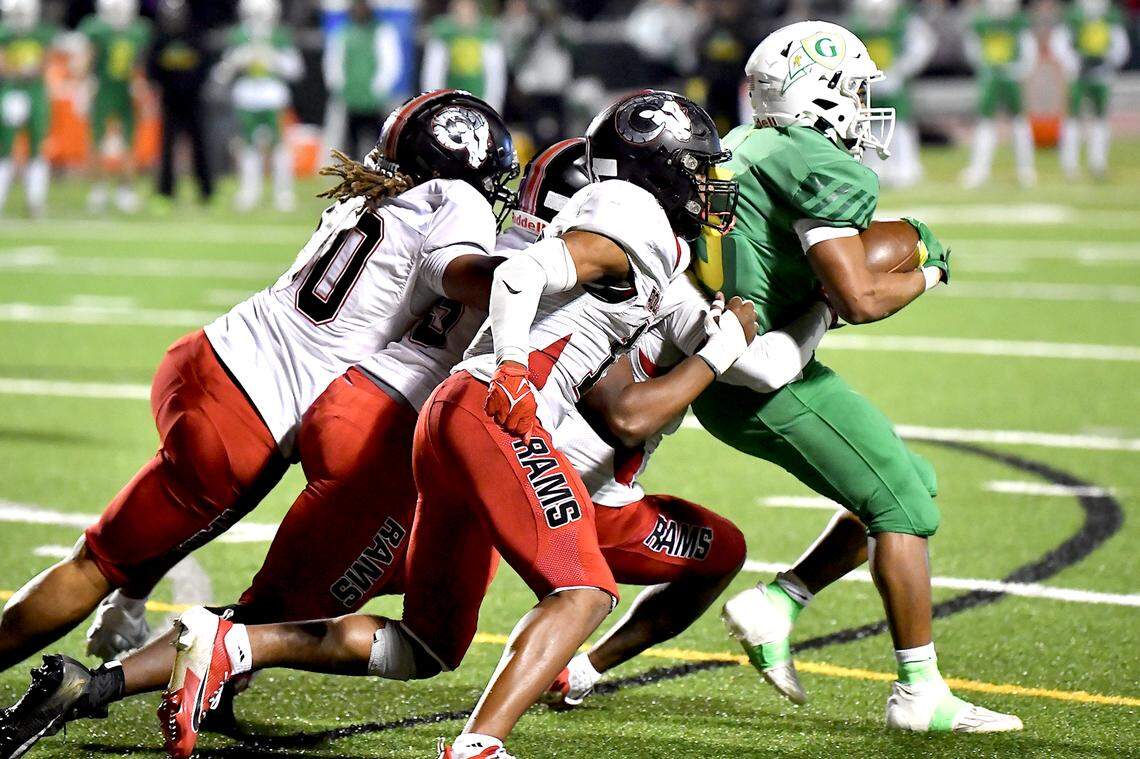 The Rolesville defense pushes back Cardinal Gibbons running back Kendall Scotton causing a loss of yards in the second half. The Rolesville Rams and the Cardinal Gibbons Crusaders met in the East Regional Final of the NCHSAA 4A football playoffs in Raleigh, N.C. on December 13, 2024.