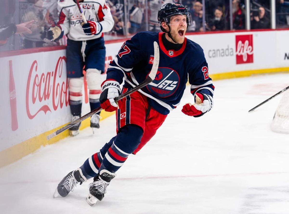 Nikolaj Ehlers of the Winnipeg Jets reacts after scoring against the Washington Capitals at Canada Life Centre on March 25, 2025 in Winnipeg, Canada. 