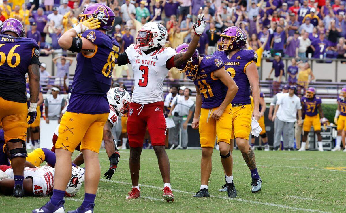 N.C. State’s Aydan White (3) celebrates after East Carolina’s Owen Daffer (41) missed a potential game-winning field goal with five seconds left in the game during N.C. States 21-20 victory over ECU at Dowdy-Ficklen Stadium in Greenville, N.C., Saturday, Sept. 3, 2022.