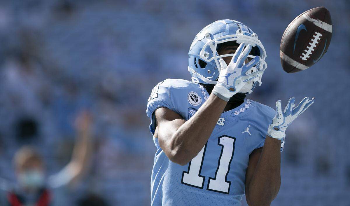 North Carolina’s Josh Downs (11) scores on a 17-yard pass from quarterback Sam Howell in the third quarter to give the Tar Heels’ a 24-7 lead on Saturday, October 24, 2020 in Chapel Hill, N.C.