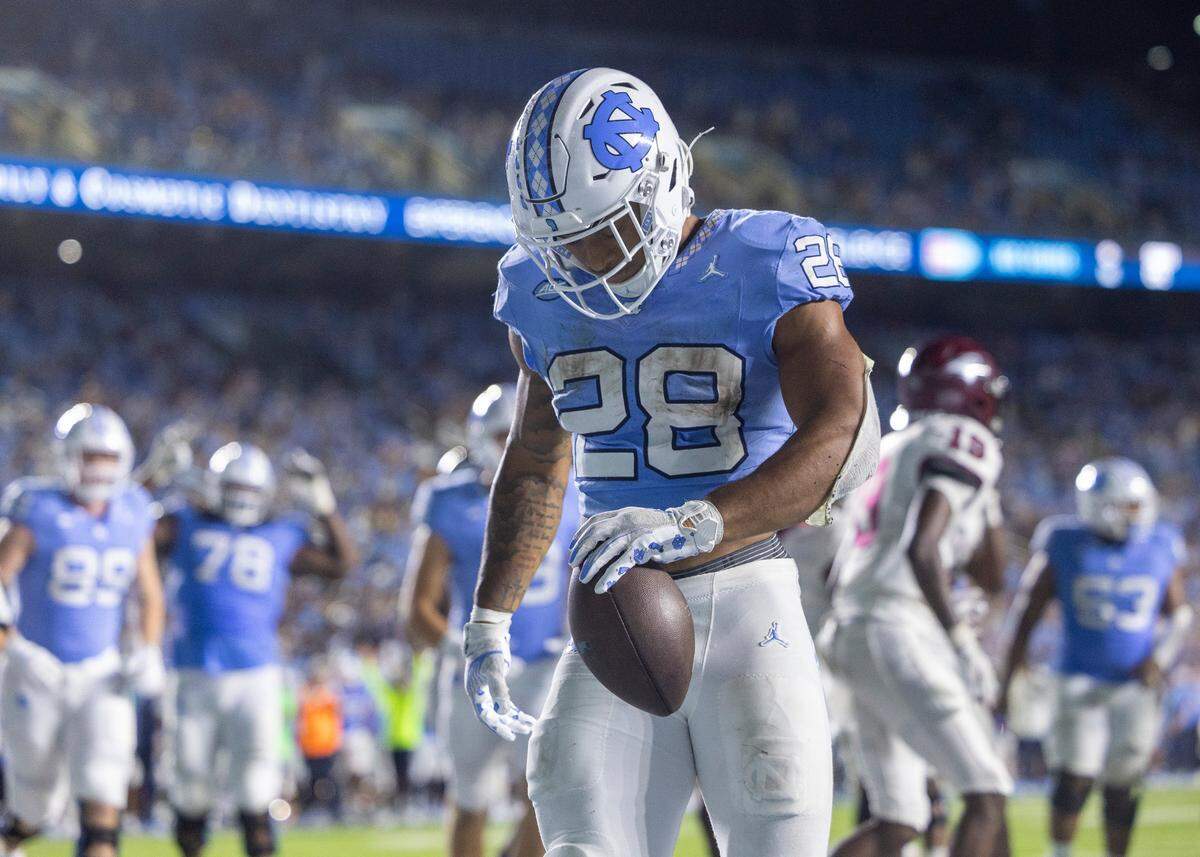 North Carolina running back Omarion Hampton (28) reacts after scoring a touchdown on a 4-yard run in the fourth quarter to give the Tar Heels a 31-10 lead over N.C. Central on Saturday, September 14, 2024 at Kenan Stadium in Chapel Hill, N.C.