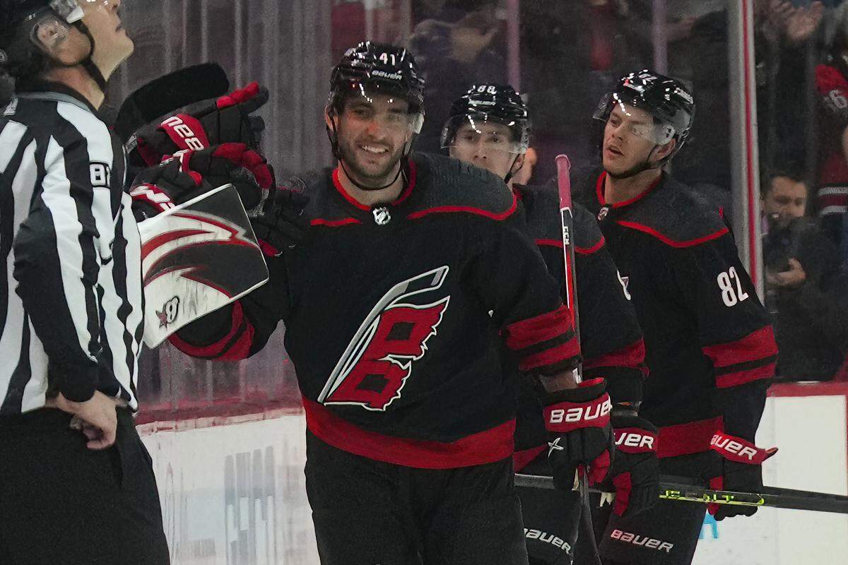 Mar 5, 2023; Raleigh, North Carolina, USA; Carolina Hurricanes defenseman Shayne Gostisbehere (41) celebrates his goal against the Tampa Bay Lightning during the second period at PNC Arena. Mandatory Credit: James Guillory-USA TODAY Sports