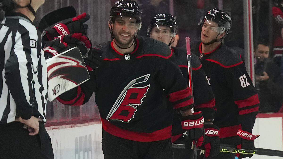 Mar 5, 2023; Raleigh, North Carolina, USA; Carolina Hurricanes defenseman Shayne Gostisbehere (41) celebrates his goal against the Tampa Bay Lightning during the second period at PNC Arena. Mandatory Credit: James Guillory-USA TODAY Sports