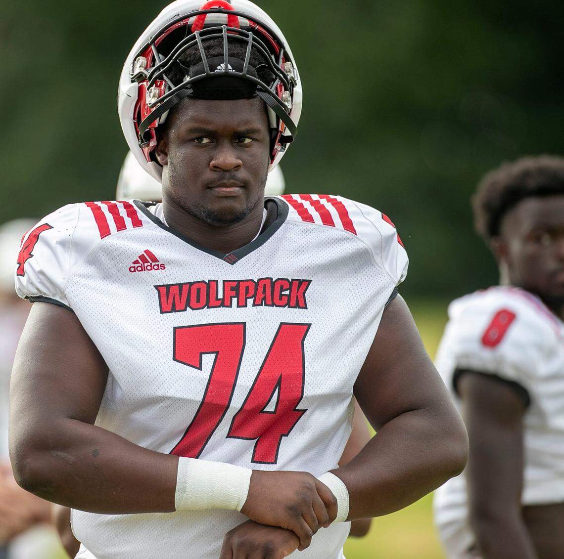 N.C. State offensive tackle Anthony Belton (74) arrives to the Wolfpacks practice on Thursday, August 11, 2022 in Raleigh, N.C.