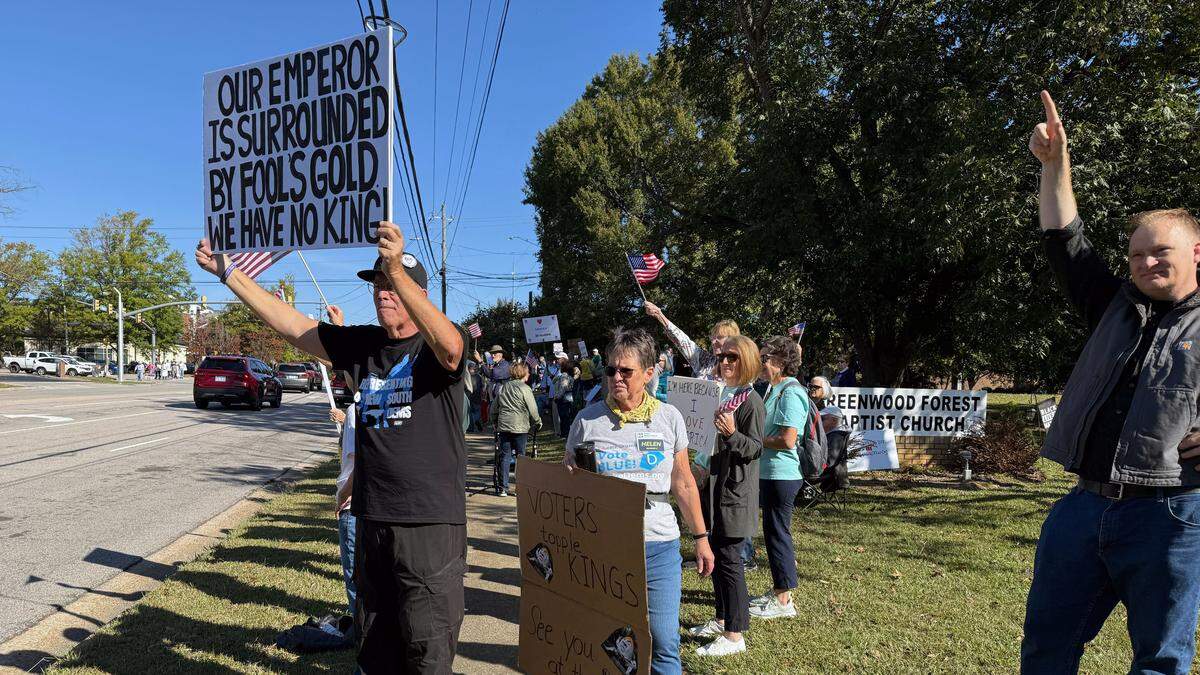 Hundreds of protesters began gathering in Cary before the scheduled start time, lining sidewalks as cars honked passing by.A handful of police officers stood nearby.