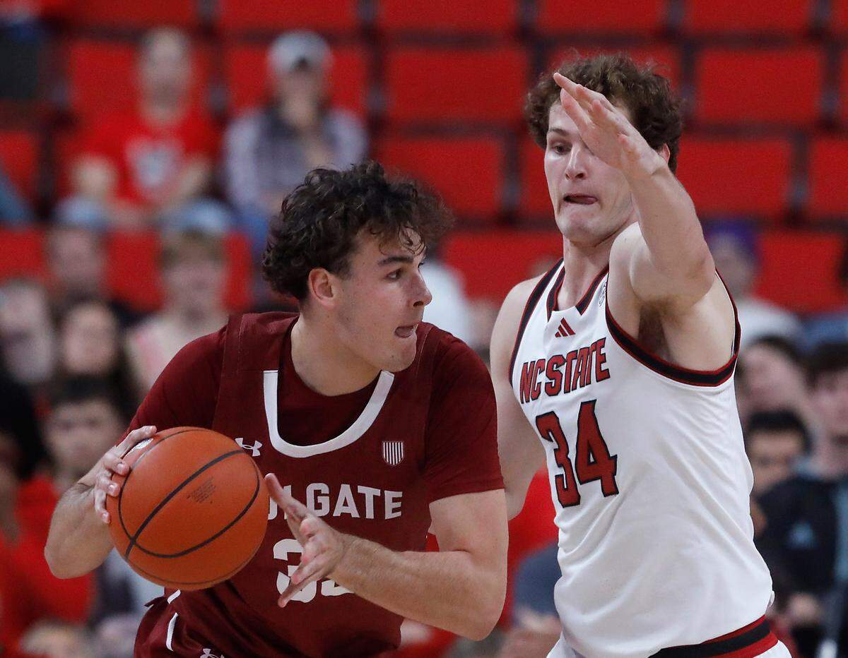 N.C. State’s Ben Middlebrooks pressures Colgate’s Sam Wright during the first half of the Wolfpack’s 72-49 win at Lenovo Center on Monday, Nov. 18, 2024, in Raleigh, N.C.