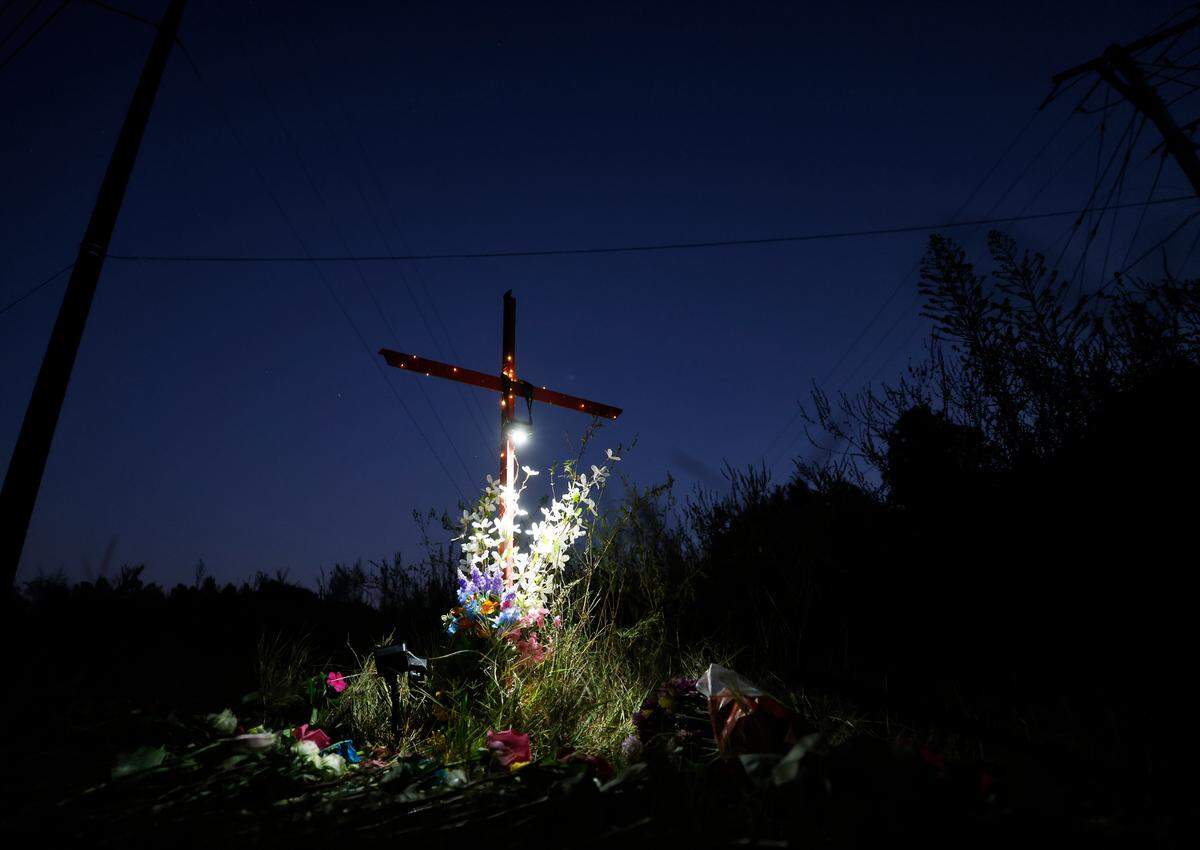 Lights illuminate a memorial for Lyric Woods, 14, and Devin Clark, 18, in Orange County on Tuesday, Sept. 20, 2022. The Orange County Sheriff’s Office said Monday the two young people found shot and killed Sunday in western Orange County are Woods and Clark.