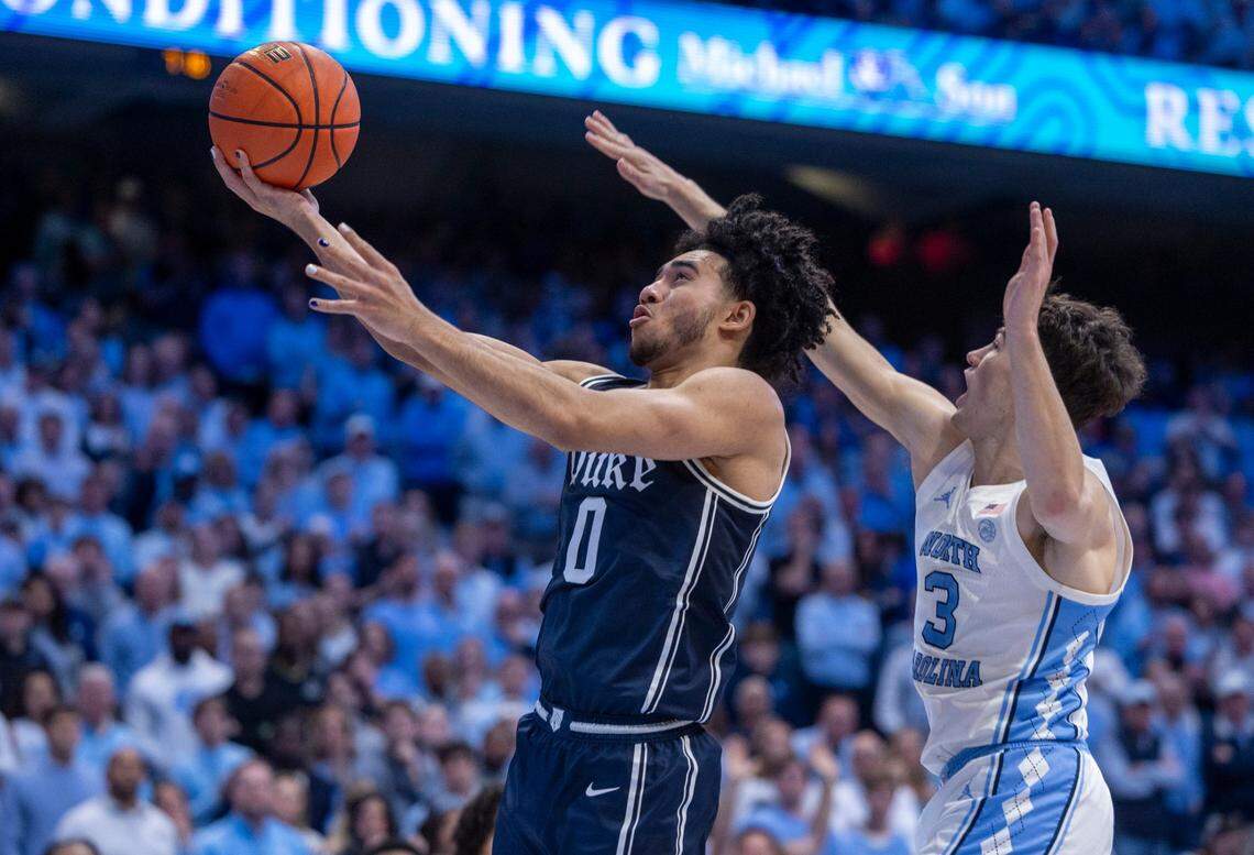 Duke’s Jared McCain (0) drives to the basket against North Carolina’s Jeremy Roach (3) in the first half on Saturday, February, 3, 2024 at the Dean E. Smith Center in Chapel Hill, N.C.