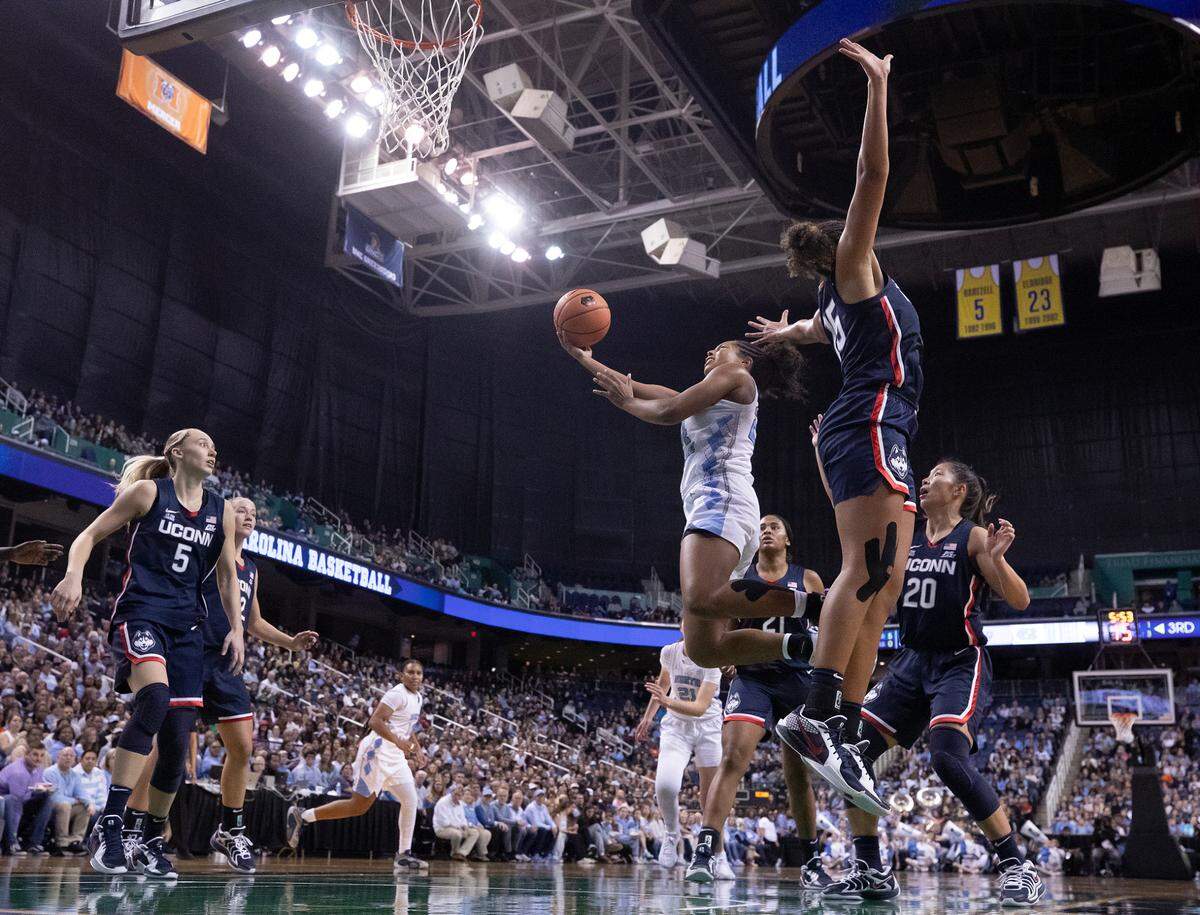 North Carolina’s Indya Nivar drives to the basket past UConn’s Ice Brady during the second half of the Tar Heels’ 69-58 loss on Friday, Nov. 15, 2024, at First Horizon Coliseum in Greensboro, N.C.