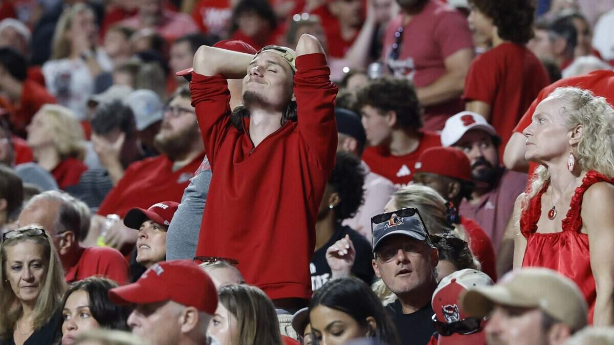 A Wolfpack fan reacts after Virginia Tech made a first down during the first half of N.C. State’s game against Virginia Tech at Carter-Finley Stadium in Raleigh, N.C., Saturday, Sept. 27, 2025.