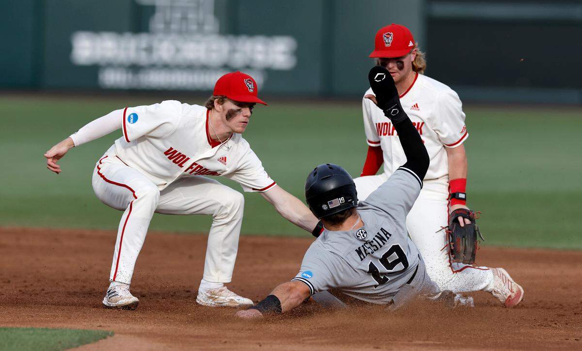 N.C. State’s Brandon Butterworth (3) tags out South Carolina’s Cole Messina (19) as he is picked off in the third inning during N.C. State’s game against South Carolina in the NCAA Raleigh Regional at Doak Field Saturday, June 1, 2024.