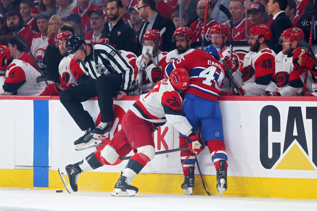 William Carrier #28 of the Carolina Hurricanes checks Alexandre Carrier #45 of the Montreal Canadiens during the first period in Game Four of the Eastern Conference Final of the 2026 Stanley Cup Playoffs at Bell Centre on May 27, 2026 in Montreal, Quebec, Canada. 