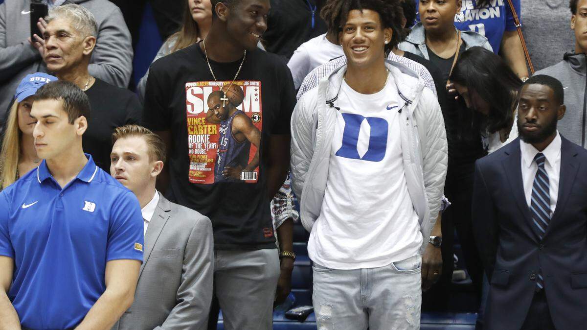 Mark Williams, left, and Jalen Johnson watch before Duke’s exhibition game against Northwest Missouri State in Durham, N.C., Saturday, Oct. 26, 2019.