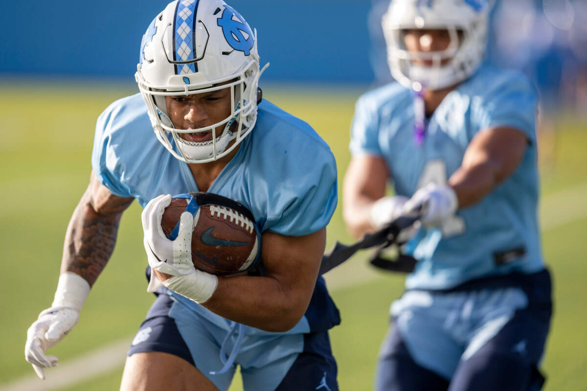 North Carolina running back Omarion Hampton (28) runs through a drill during the Tar Heels’ opening day of spring football practice on Tuesday, March 19, 2024 in Chapel Hill, N.C.