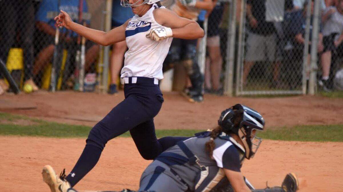 Hoggard’s Skyler Walker scores just before the throw to win 4-3 against Heritage in the eighth inning in game two of the east regional final in Wilmington, N.C., Thursday, May 23, 2019. [MATT BORN/STARNEWS]
