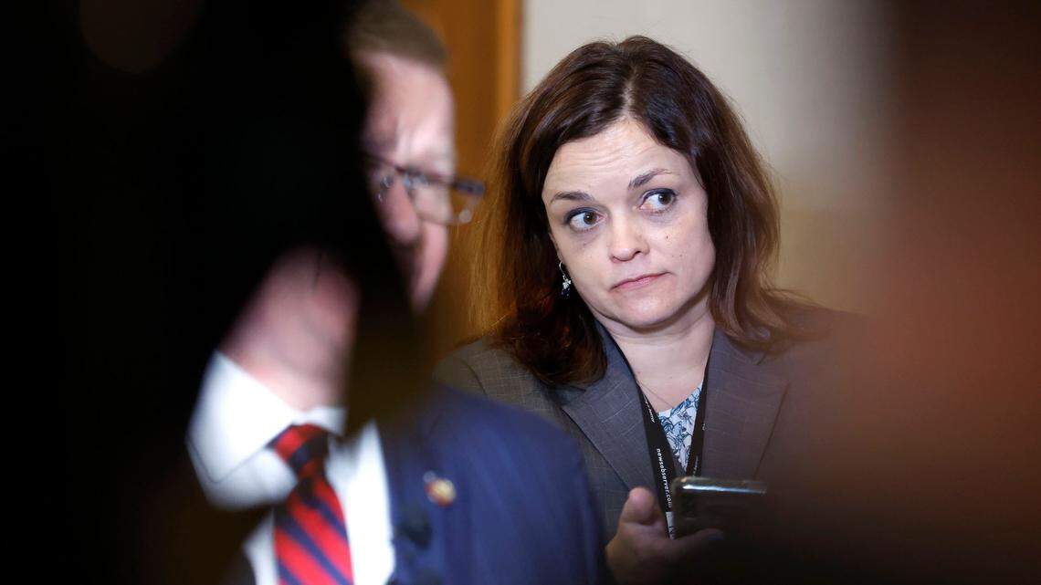 Dawn Baumgartner Vaughan listens to House Speaker Tim Moore during a press gaggle the first day of session of the N.C. House of Representatives, Wednesday, Jan. 11, 2023.