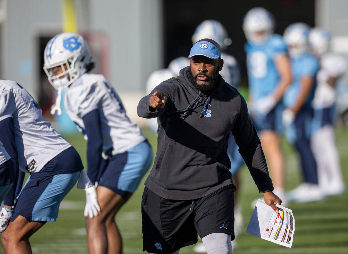 North Carolina assistant head coach for defense, Charlton Warren works with his unit during the opening day of spring football practice on Tuesday, March 19, 2024 in Chapel Hill, N.C.