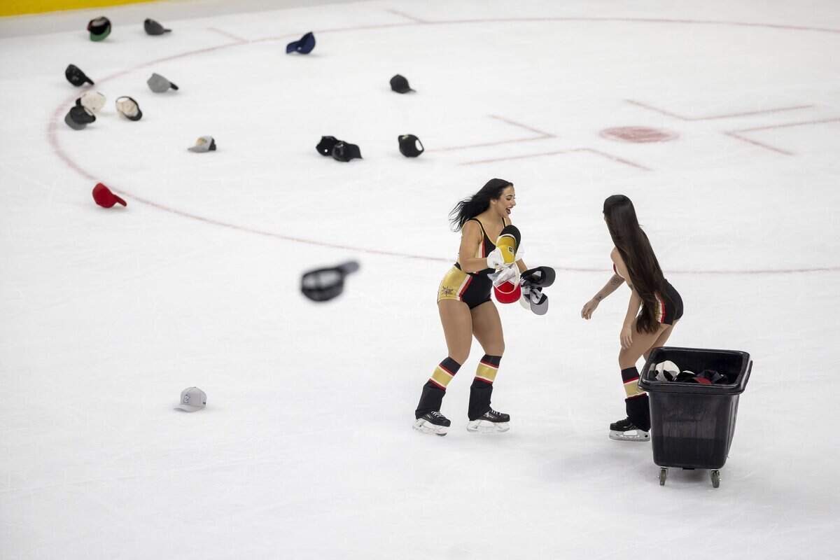 The Vegas ice crew removes hats from the ice after a hat trick by right wing Mitch Marner (93) to take a 4-0 lead over the Carolina Hurricanes in Game 3 of the Stanley Cup Final, on Saturday, June 6, 2026 at T-Mobile Arena in Las Vegas, NV.