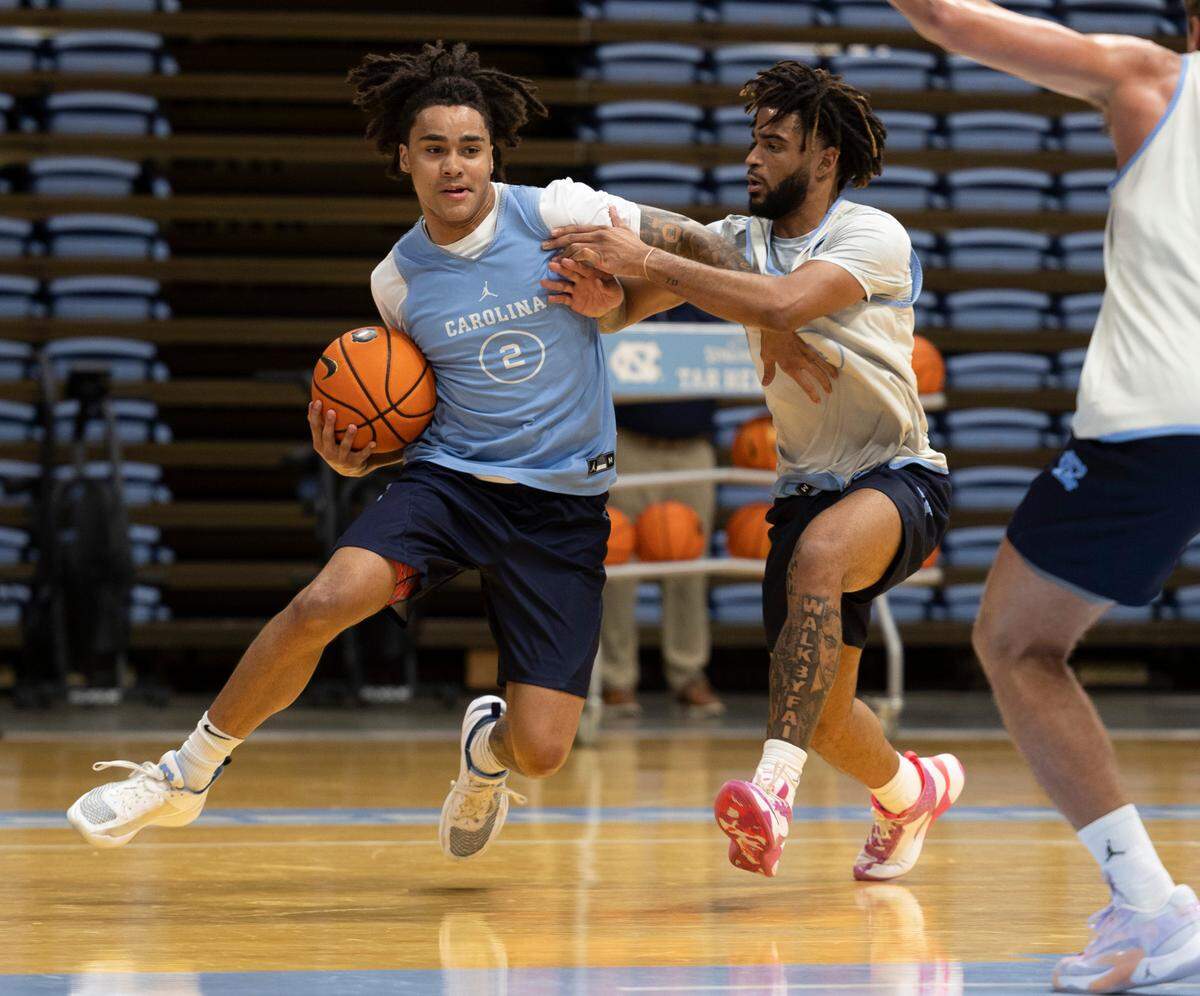 North Carolina freshman Elliott Cadeau drives against R.J. Davis (4) during the Tar Heels’ practice on Friday, October 6, 2023 at the Smith Center in Chapel Hill, N.C.
