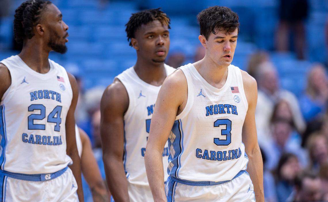 Down by seven points with two seconds to play, North Carolina’s Jae’Lyn Withers (24), Harrison Ingram (55) and Cormac Ryan (3) break from a team huddle as Clemson hands the Tar Heels their first defeat at home on Tuesday, February 6, 2024 at the Dean E. Smith Center in Chapel Hill, N.C.