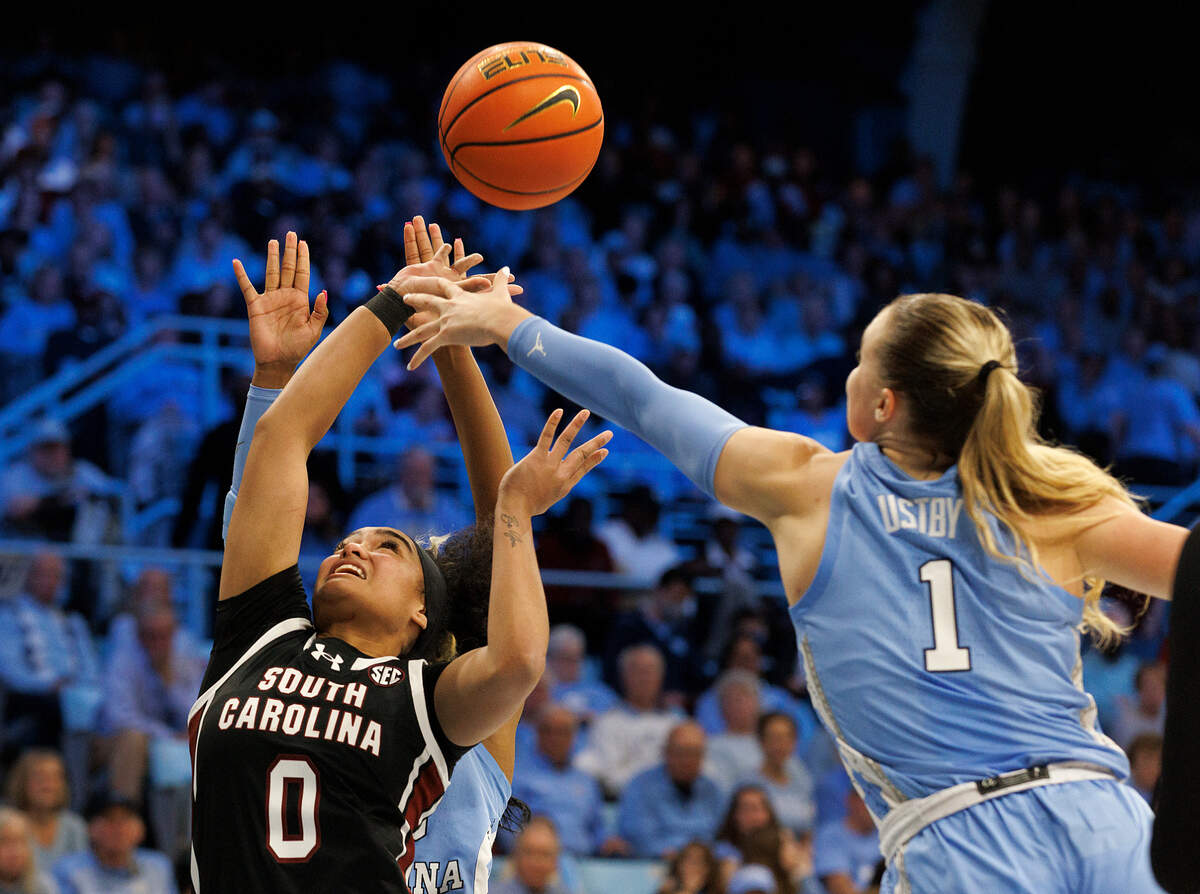 South Carolina’s Te-Hina Paopao drives past North Carolina’s Alyssa Ustby during the second half of the Tar Heels’ 65-58 loss on Thursday, Nov. 30, 2023, at Carmichael Arena in Chapel Hill, N.C.