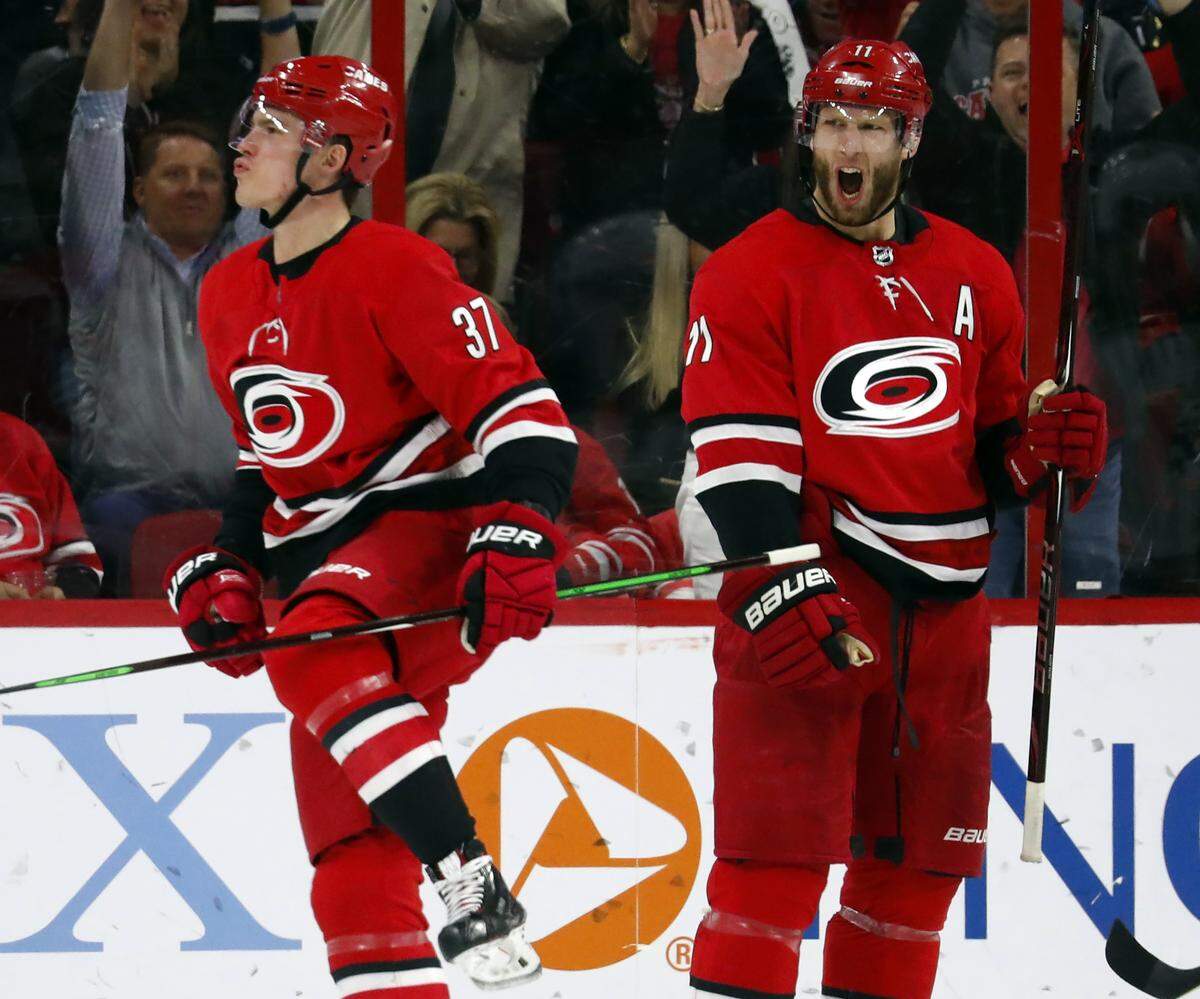Carolina Hurricanes’ Andrei Svechnikov (37) celebrates his goal with teammate Jordan Staal (11) reacting nearby during the third period of an NHL hockey game against the Minnesota Wild, Saturday, March 23, 2019, in Raleigh, N.C. (AP Photo/Karl B DeBlaker)
