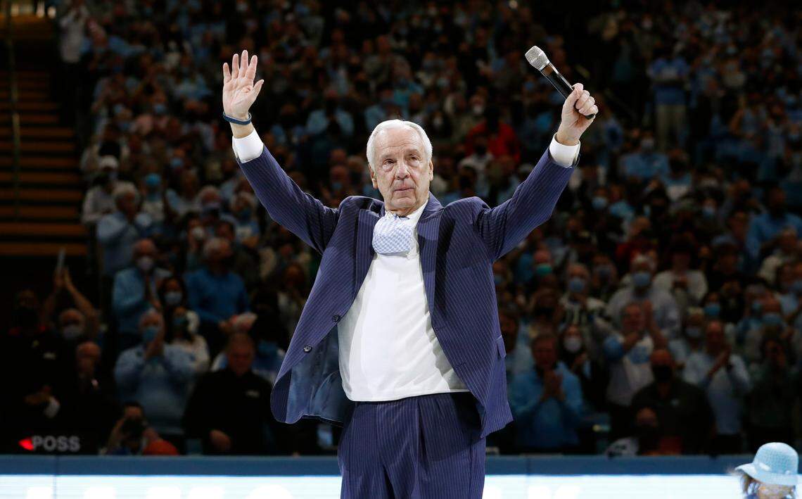 Roy Williams acknowledges the crowd after a halftime ceremony during UNC’s game against N.C. State at the Smith Center in Chapel Hill, N.C., Saturday, Jan. 29, 2022.