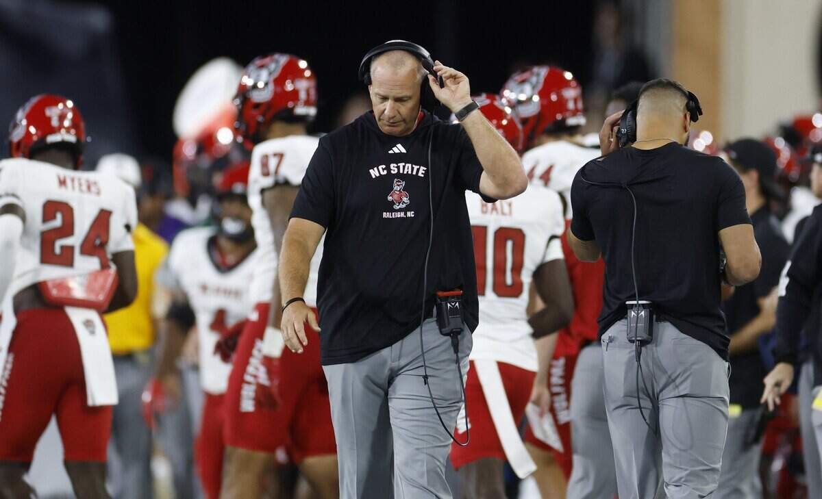 N.C. State head coach Dave Doeren walks the sideline in the first half of N.C. State’s game against Wake Forest at Allegacy Stadium in Winston-Salem, N.C., Thursday, Sept. 11, 2025.