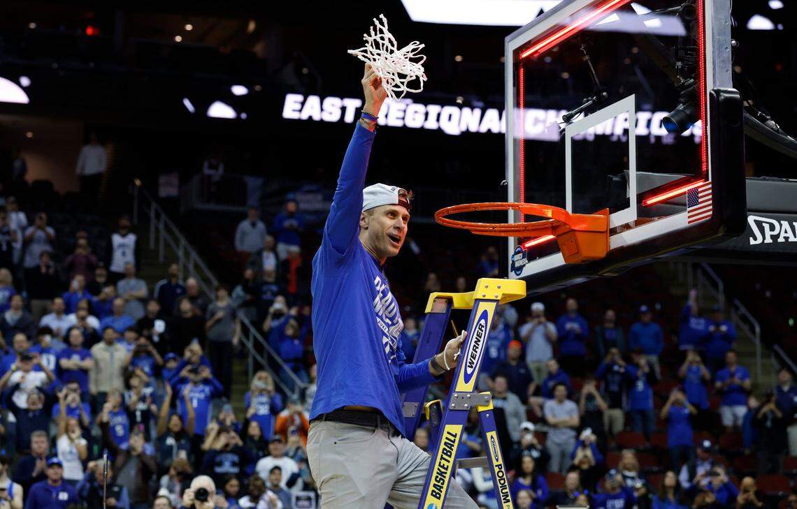 Duke’s head coach Jon Scheyer holds up the net after cutting it down after Duke’s 85-65 victory over Alabama in their Elite 8 game in the 2025 NCAA Men’s Basketball Championship at the Prudential Center in Newark, N.J., Saturday, March 29, 2025.